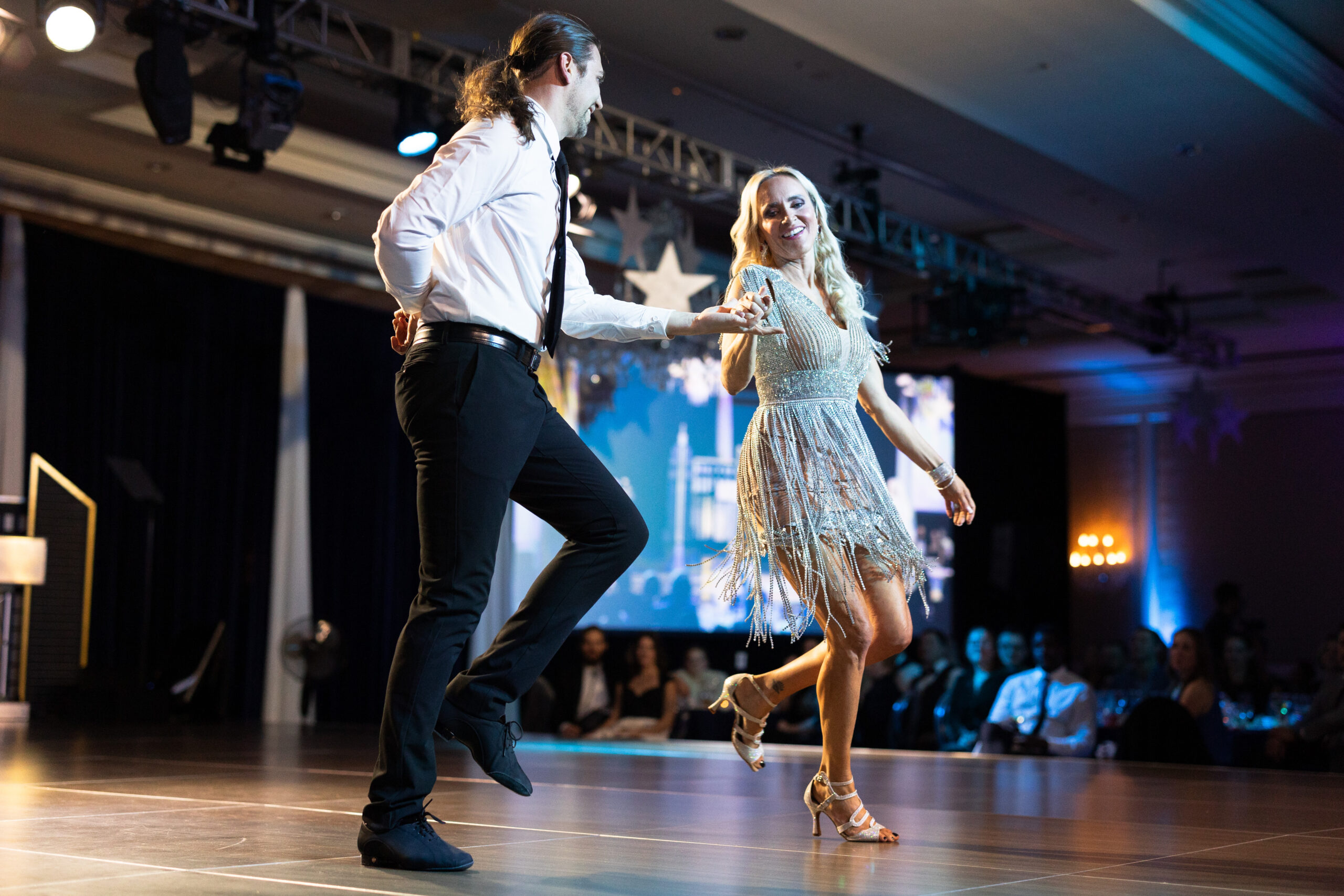 Image of two people dancing on stage during Dancing with the St. Louis Stars 2024