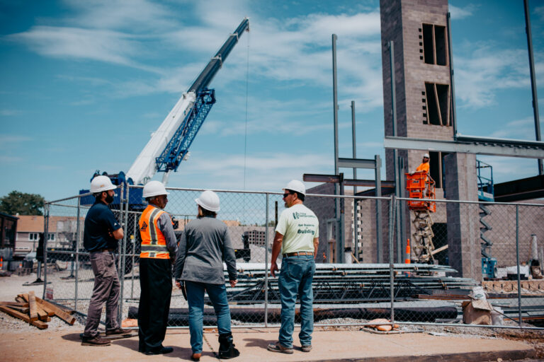 People looking over a construction in-progess.